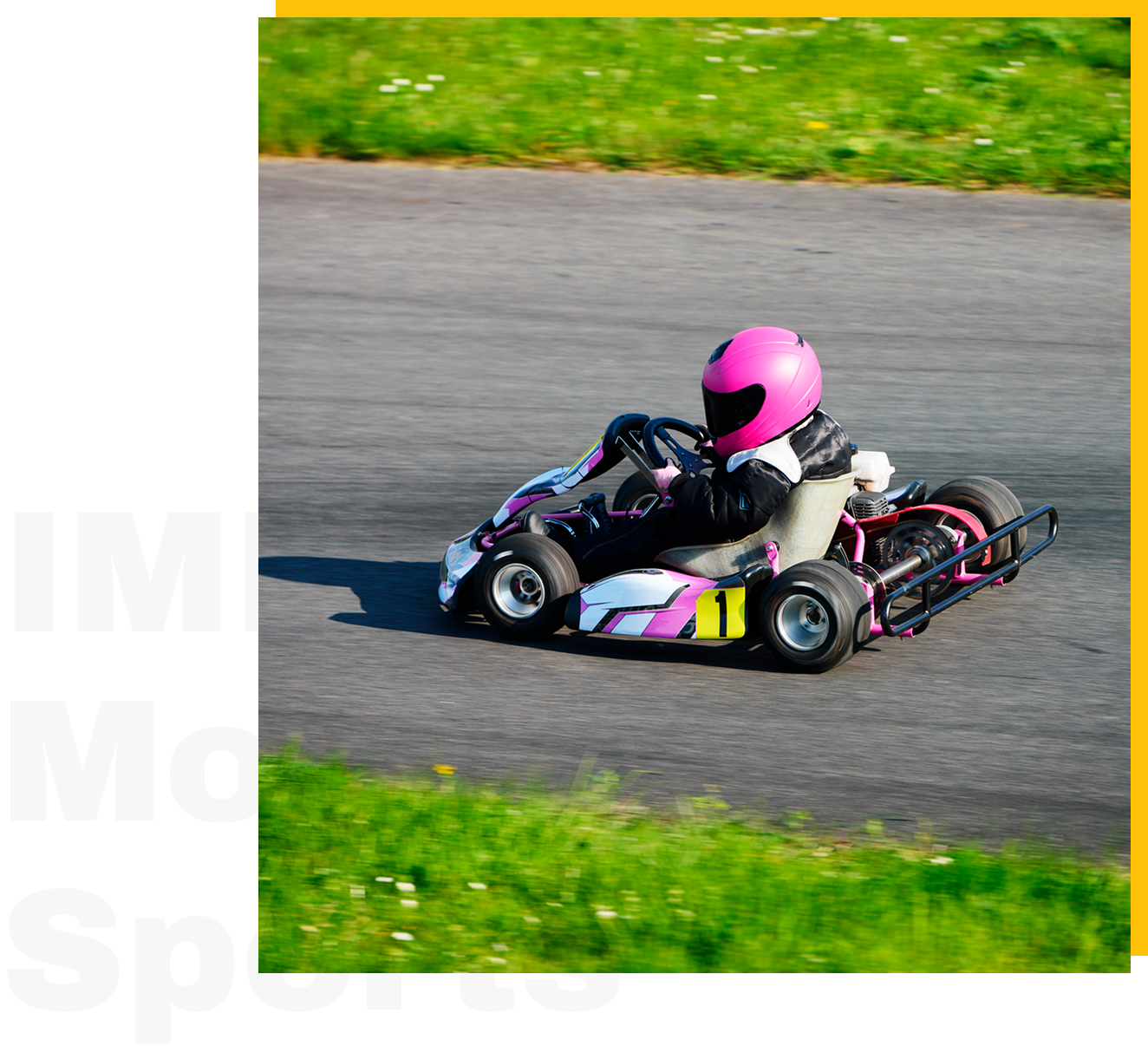 Go-kart racer in pink helmet driving.